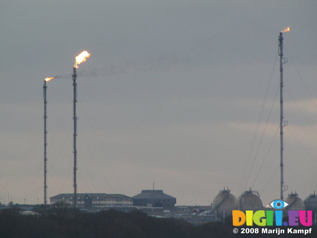 SX01129 Flames from oil refinery chimneys Milford Haven